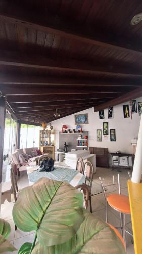 a living room with a table and a couch at Sítio do piu in Lombas