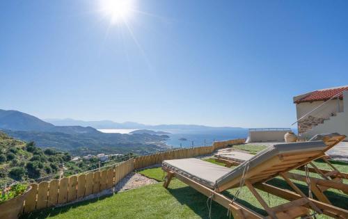 a view of the ocean from the balcony of a house at Villa Maestoso in Mirsíni