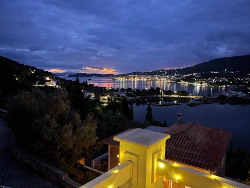 a view of a city from a building at night at Skiathos Seaview Villa with Pool in Punta