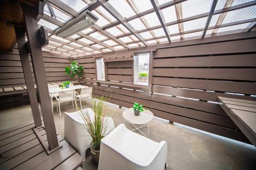 a room with tables and chairs and a glass ceiling at 春日レジャーホテル in Fukuoka