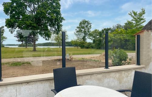 a table and chairs in front of a window with a view at Beautiful Home In Øster Ulslev With Wifi in Øster Ulslev
