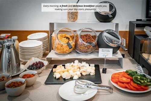 a display of food on a counter in a kitchen at Trivrh Outdoor Hotel in Žirovnica