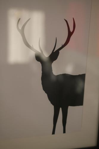 a silhouette of a deer on a wall at Haus Sonnenblick in Lam