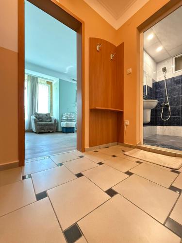 a bathroom with a shower and a toilet and a sink at Fresh Kiten in Kiten