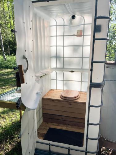 an outside sauna with a ladder next to it at Lahemaa Nature Glamping - Eha in Vihasoo