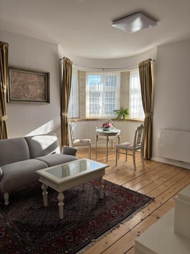 a living room with a couch and a table at Penzion Hněvotín 88 in Hněvotín