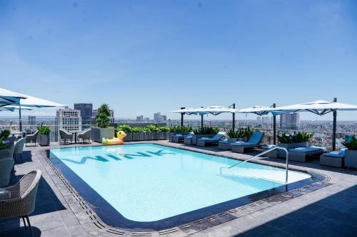 a large swimming pool on top of a building at Wink Hai Phong Centre, Unscripted by Hyatt - 24 Hours stay in Hai Phong