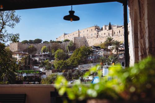 a view of a castle from a window of a building at City of David - Boutique Stay by the Western Wall in Jerusalem