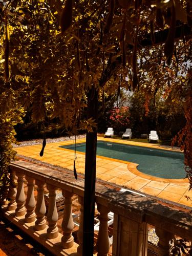 a view of a swimming pool from a fence at HOTEL RESTAURANT TURÓ de la TORRE in Manresa