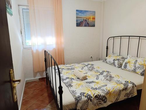a bed with a comforter and pillows in a bedroom at Green Valley GV in Kotor