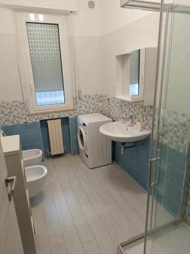 a bathroom with a sink and a toilet and a shower at Giulianova vacanze in Giulianova