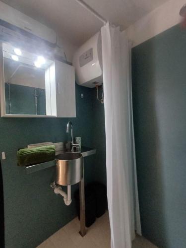 a bathroom with a sink and a mirror at Jasmine & Rose House in Udine