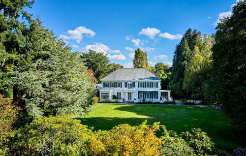 an aerial view of a large white house on a lawn at Fernside Estate and Gardens in Fernside