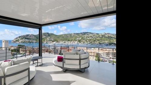a living room with a view of the ocean at The One in Port d'Andratx