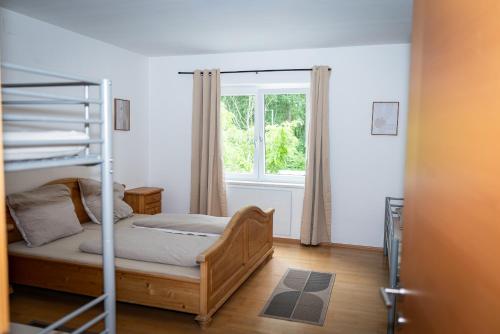 a bedroom with a bunk bed and a window at Apartment Camping Melk in Melk