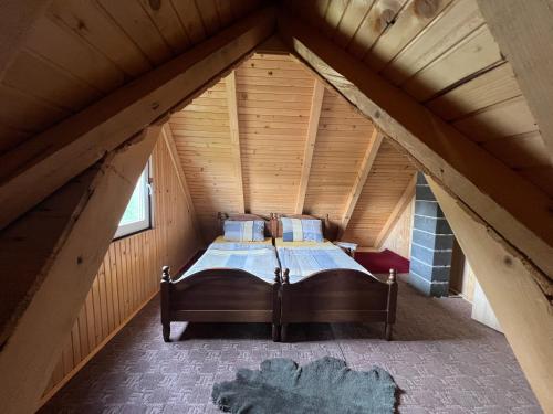 a bed in a room in a attic at Mirno mjesto in Mujakovići