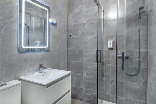 a bathroom with a shower and a sink at Villa My Garden in Zamárdi