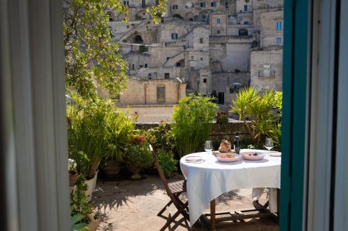 a table and chairs with a view of a city at Da Ida - Matera Cento Storico - Sassi in Matera