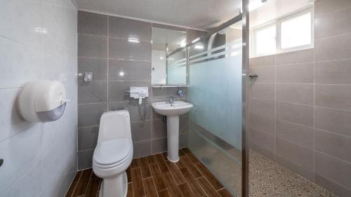 a bathroom with a toilet and a sink at Jeju seawalk in Namwon