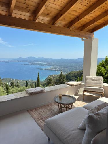 a living room with a view of the water at Villa Kalivista in Spartýlas