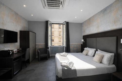 a hotel room with a bed and a television at Bramble Luxury Suites in Rome