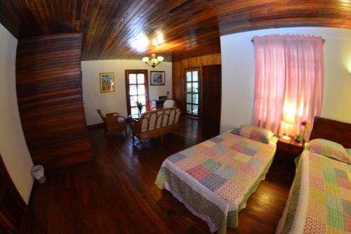 Ein Bett oder Betten in einem Zimmer der Unterkunft Hotel Posada Don Pantaleon