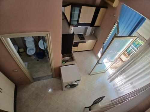 an overhead view of a living room and kitchen in a house at Proper Apartment in Vlorë