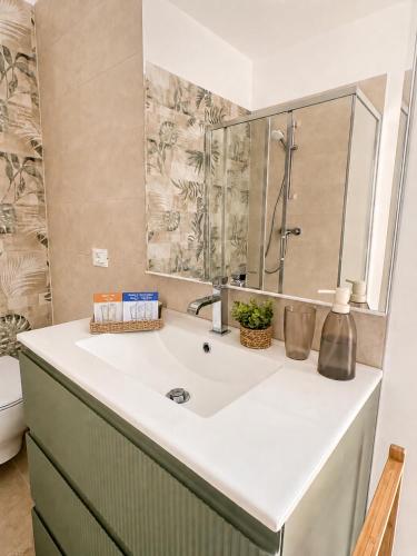 a bathroom with a sink and a mirror at Appartamento Sofia in Sossano