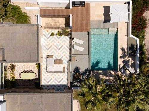 an aerial view of a house with a swimming pool at The Homega Villa in Il-Madliena