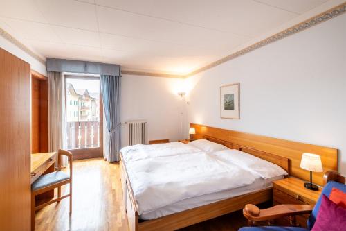 a bedroom with a white bed and a window at VILLA NUOVA in Romeno
