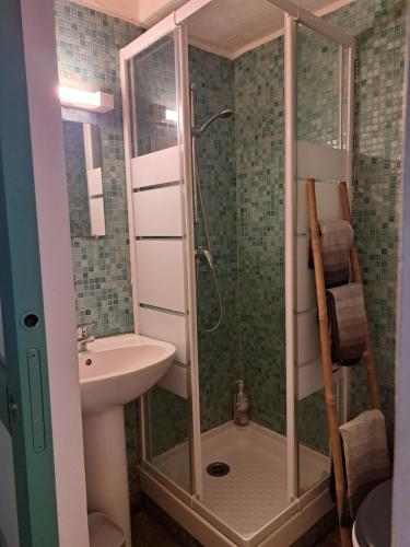 a bathroom with a shower and a sink at Au coeur d'Uzès in Uzès