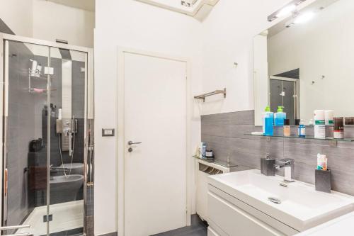 a bathroom with a sink and a shower at De' Fusari, Bologna by Short Holidays in Bologna