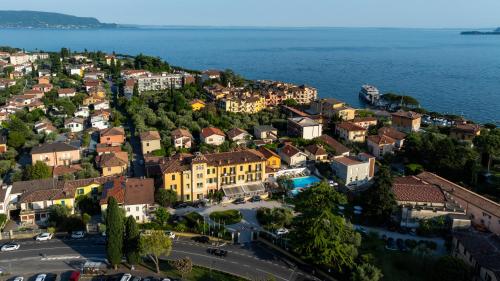 an aerial view of a town by the water at Hotel Maderno by Double Hospitality in Toscolano Maderno
