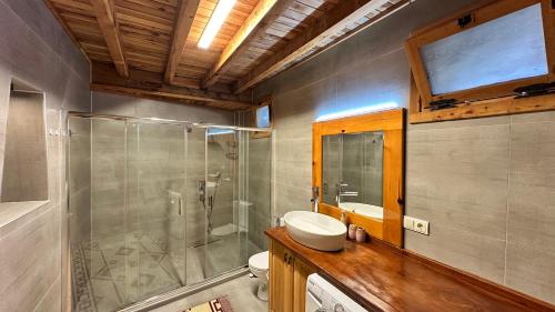 a bathroom with a toilet and a sink and a shower at Infinity villa in Fethiye