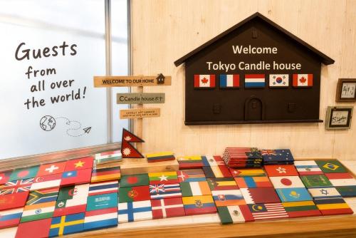a bed in a room with a colorful quilt at Tokyo Candle house in Tokyo