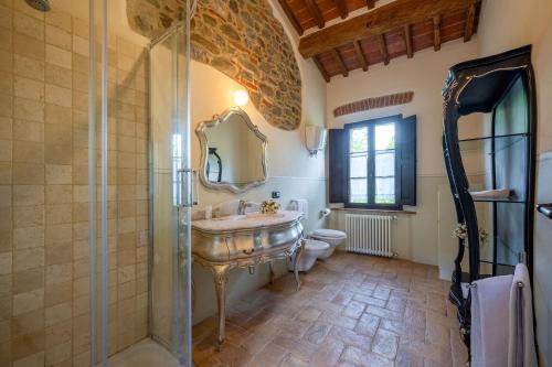 a bathroom with a sink and a shower at PODERE BELLARIA 18&2, Emma Villas in Rapolano Terme