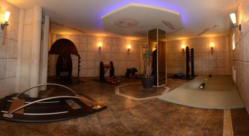 a room with a gym with a car in it at Gästehaus Kloster Nimbschen in Grimma