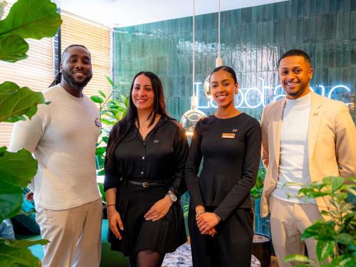 a group of people posing for a picture at Mercure Paris Montparnasse Pasteur in Paris