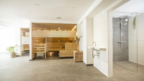 a bathroom with a shower and a sink at apartments '43 in Reith im Alpbachtal