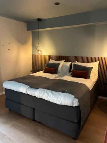 a bedroom with a large bed in a room at Engeltofta Sea Lodge in Gävle