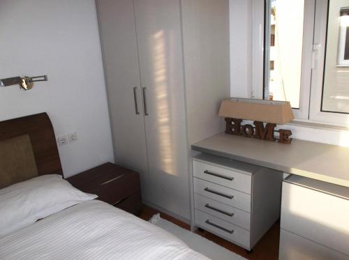 Ένα ή περισσότερα κρεβάτια σε δωμάτιο στο Vanessa House Luxury Apartments