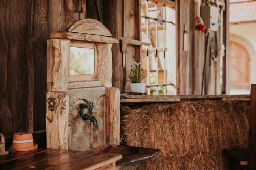 an old kitchen with a sink and a mirror at RANČ JUREŠ - Relaxing Countryside Escape in Ljutomer