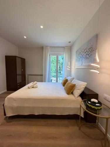 a bedroom with a large bed and a window at Pratelli B&B in Saludecio