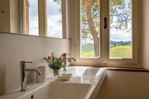 a bathroom with a sink and a window at Villa Caterina 8, Emma Villas in San Gimignano