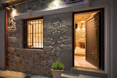 a room with a window and a door with a plant at Diastar Boutique in Heraklio
