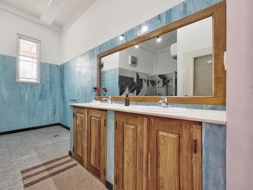 a bathroom with a sink and a mirror at Phoenix house ahangama in Ahangama