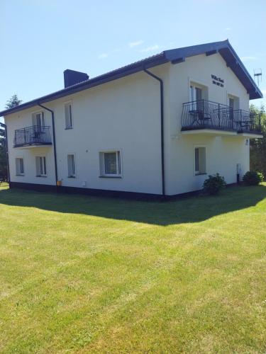 a large white house with a large yard at WillaSimi in Władysławowo