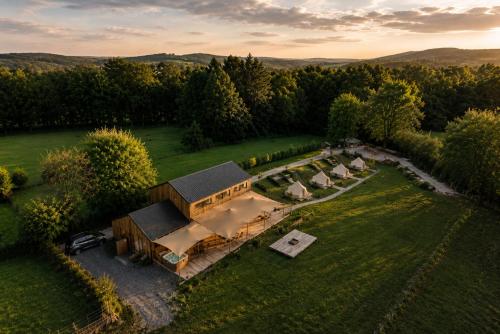 an aerial view of a large house with a yard at Le Domaine de Bra in Bra