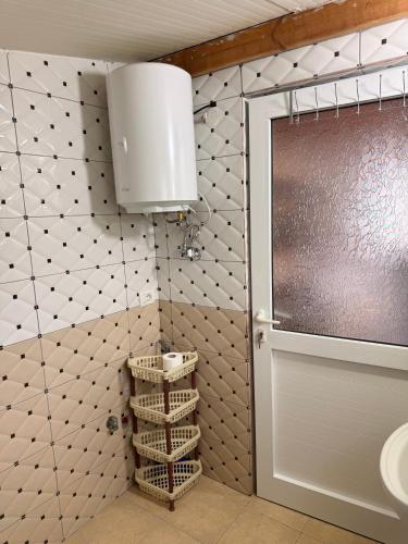 a bathroom with a toilet and a sink at Denaj House in Himare