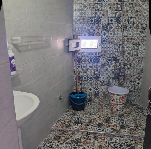 a bathroom with a sink and a toilet in it at Bleu Chefchaouen in Chefchaouen
